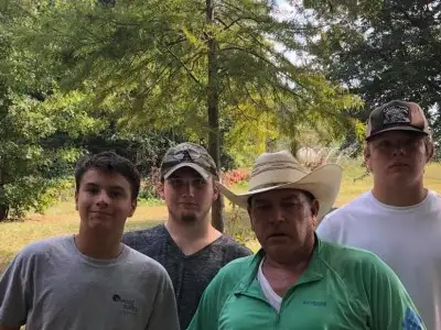 Randy Phillips with high school students after a surveying class in Clanton